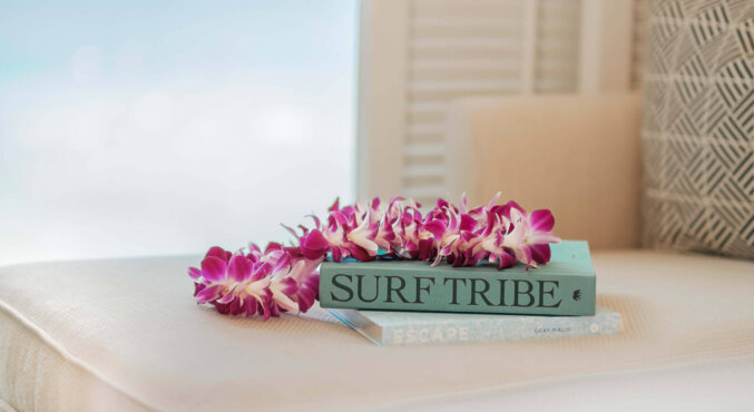 Book and purple lei at Halepuna